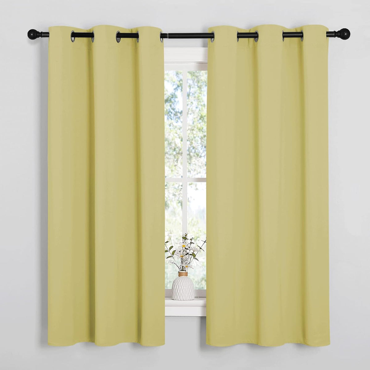 63"L x 42"W polyester curtains in Paler Yellow